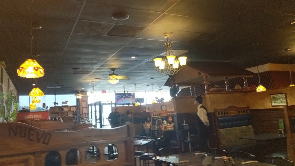 Family-style restaurant tables with drinks and meals.
